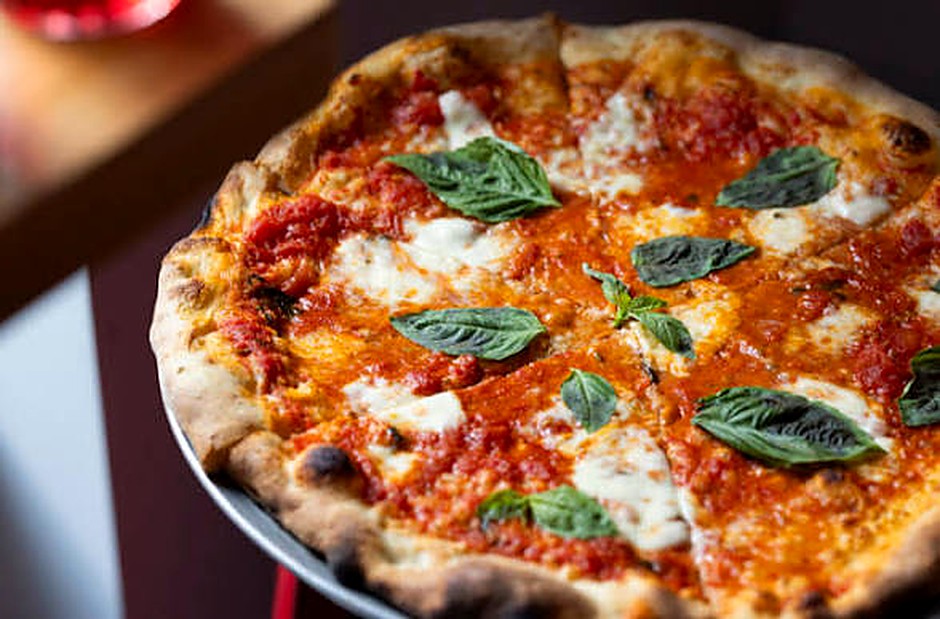 Fresh margherita pizza with basil