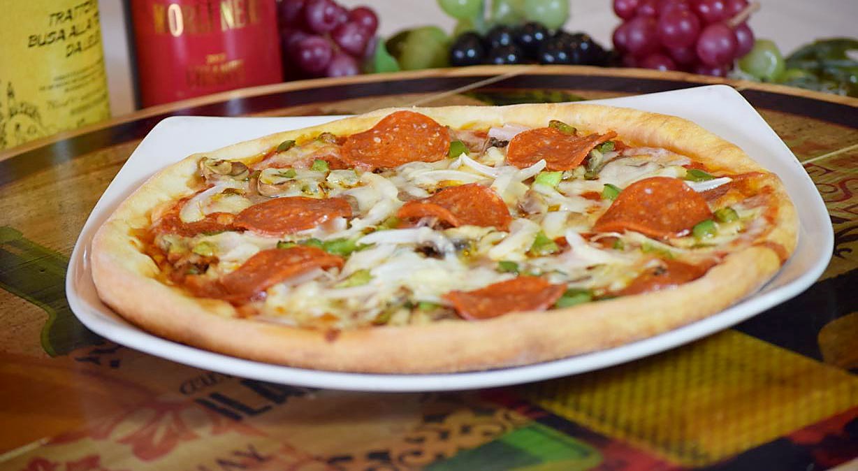 Traditional pizza with pepperoni, peppers, and onion